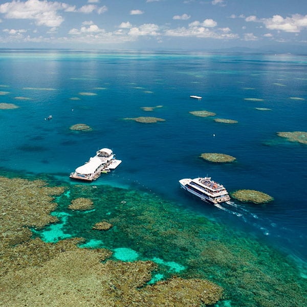 Coral reef islands surrounded by deep blue ocean